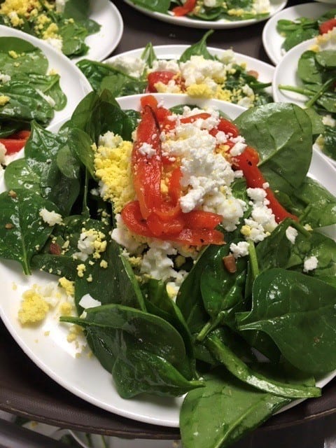 5 Baby spinach Salad with goat cheese roasted julienne red peppers and sliced hard boiled eggs with a warm bacon vinaigrette - Entrees