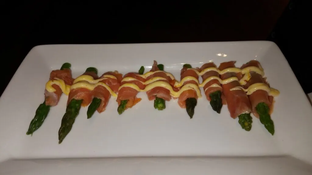 House smoked salmon wrapped around asparagus tips tarragon sauce 1024x576 - Butlered Hors d'oeuvres